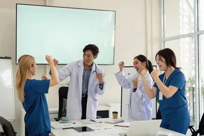 Cardiology Puns for healthcare careers featuring a friendly cardiology team in a professional hospital workspace