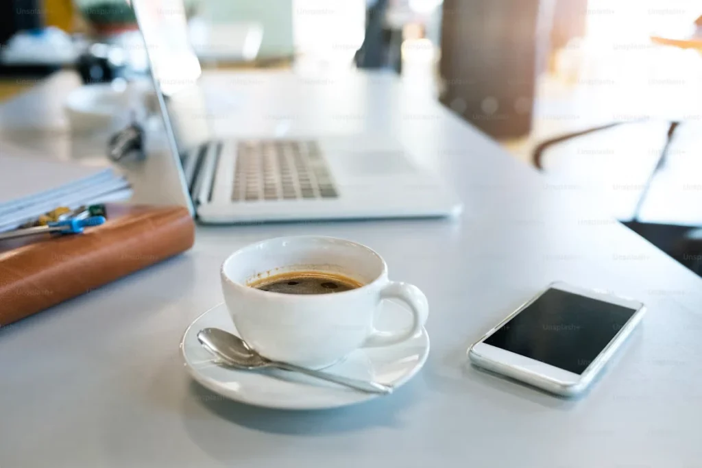 Short Puns for work and coffee beside a modern office laptop
